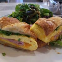 Breakfast Croissant Sandwich · Black Forest ham, cheddar, egg and arugula served with baby mixed greens.