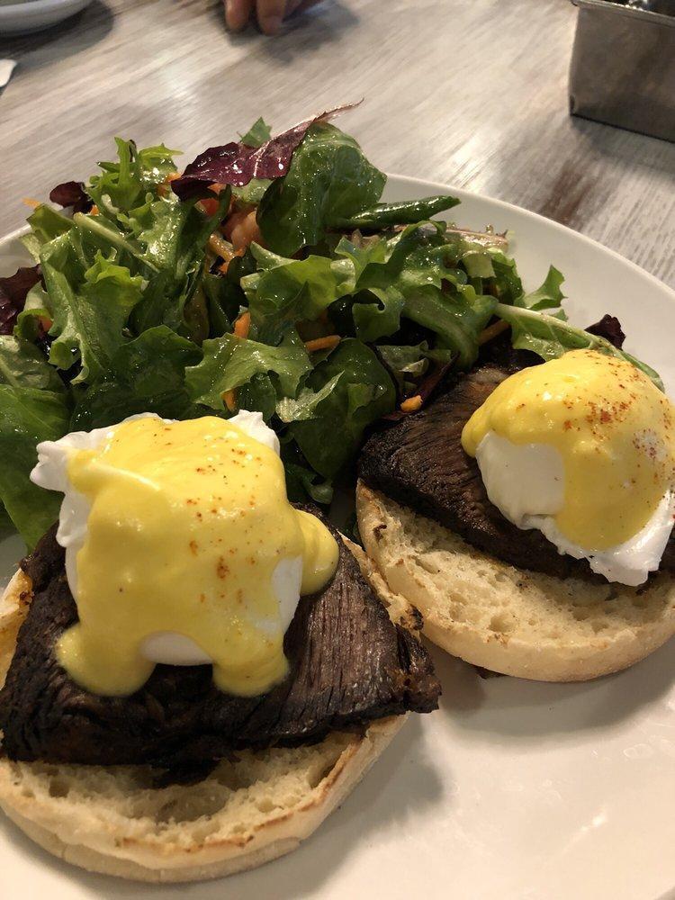 Amandine Eggs Benedict · On homemade biscuit with braised short rib, poached eggs, Hollandaise with baby mixed greens.