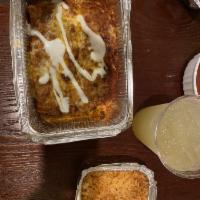 Enchiladas · 3 rolled corn tortillas stuffed with choice of style. Topped with sour cream, melted cheese ...