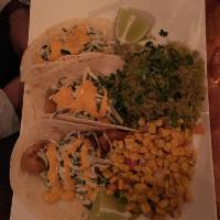Tacos · 2 corn tortilla tacos with your choice of style. Topped with lettuce, tomatoes, cheese and s...
