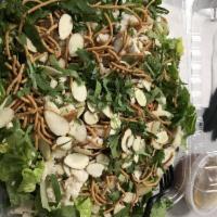 Asian Chicken Salad · Diced chicken breast, almonds, crispy noodles, cilantro and sesame seeds.