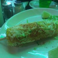 Elote · Mexican style street corn with chile, lime, epazote, Cotija cheese and mayo.
