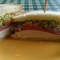 Pot Belly Sandwich · Slices of turkey breast topped with pastrami, Monterey jack cheese, onions, tomato, clover s...
