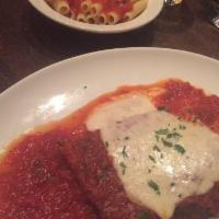 Chicken Parmigiana · A breaded breast covered with tomato sauce and melted mozzarella.