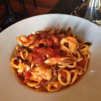 Shrimp and Calamari · Sauteed in a savory red sauce and served over linguini.