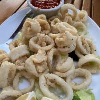 Traditional Fried Calamari · Tender rings and tentacles dredged in flour, fried to perfection and  served with homemade m...