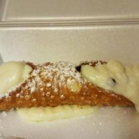 Cannoli · Pastry shell filled with sweet ricotta cream and chocolate chips.
