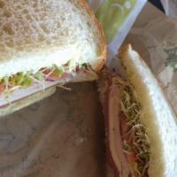 Pot Belly Sandwich · Slices of turkey breast topped with pastrami, Monterey Jack cheese, onions, tomato, clover s...