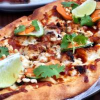 Crunchy Thai Flatbread · Grilled chicken breast, pickled carrots, cucumbers, cilantro and chopped peanuts with a spic...