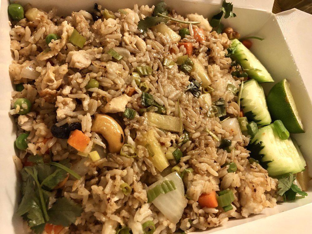 Pineapple Fried Rice with Shrimp · This dish is exotic, colorful and bursting with flavor and then its added to a wok-full of shrimps, cashew nuts, pea-carrot, and drizzled with raisins.