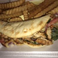 Chicken Gyro · Grilled chicken on a pita bread with tomatoes, onions, lettuce and tzatziki sauce. Served wi...