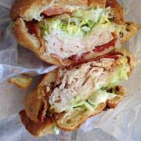 Club Croissant · Oven roasted turkey breast, melted provolone cheese, bacon, lettuce, tomatoes and mayonnaise...