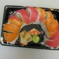 Rainbow · Eight pieces. California roll with salmon, tuna and avocado on top. Raw.