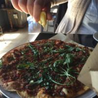 Turkish Flatbread · Lamb and beef mixture, Turkish pepper paste, parsley, arugula and spices.