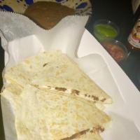 Quesadilla · Cooked tortilla that is filled with cheese and folded in half. 