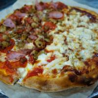 Meat Lovers Pie · Crushed tomato, mozzarella, Parmesan, pepperoni, ham, Italian sausage, bacon and beef.