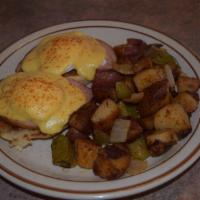 Eggs Benedict · Ham with 2 Poached Eggs on a Toasted English Muffin with Hollandaise Sauce and Hash Browns