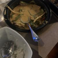 Red Curry · Thai style red curry with bamboo shoots, green beans, bell peppers, Thai eggplant, basil lea...