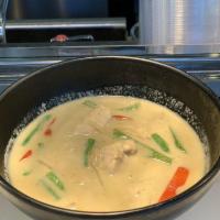Green Curry · Classic curry with coconut milk in a light green sauce, eggplant, bamboo shoot, string beans...