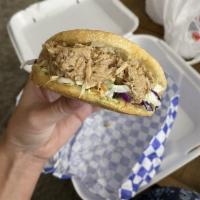 Pork Arepa · Roasted pork, mix cabbage, tomatoes and white cheese.