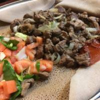 Habesha Tibs · Well done, medium well or juicy. Tender beef sauteed with onion and jalapeno with a touch of...