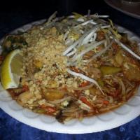 Pad Thai · Sauteed rice noodles with eggs, beansprouts and green onions, topped with crushed peanuts. G...