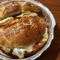 Grilled Chicken Panini · Grilled chicken topped with fresh mozzarella, roasted peppers, and sliced tomato on panini b...