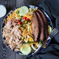Smokehouse Salad · Smoked turkey, Texas brisket, cheddar & jack cheeses, roasted corn relish, cucumbers, red on...
