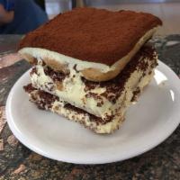 Tiramisu · a slice of our house-made tiramisu made with lady fingers dipped in espresso and cognac, lay...
