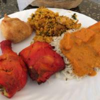 Chicken Biryani · Contains nuts. Aromatic basmati rice cooked with chicken, nuts, herbs, and spices.
