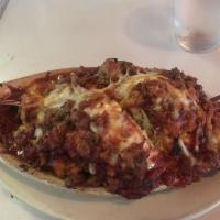 Lasagna · Pasta layered with ricotta and mozzarella cheese and topped with marinara sauce.