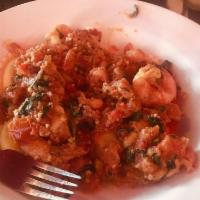 Garlic Shrimp and Cheese Ravioli · Jumbo shrimp sauteed with fresh and sun-dried tomatoes in a garlic sauce over ravioli.