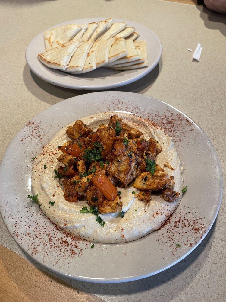 Shawarma · Thinly sliced seasoned filet tenderloin, sauteed with tomatoes and onions. Topped with tahini sauce and served with pita bread.
