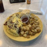 Piedmont Omelette · 3 eggs, chicken sausage, bacon, sauteed onions, and cheddar cheese, served with creamy dream...