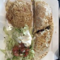 Fajita Quesadilla · A flour tortilla stuffed with your choice of meat mixed with grilled onions, and bell pepper...