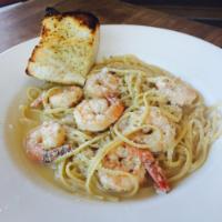 Shrimp Scampi · Shrimp sauteed with fresh garlic and tomatoes in our lemon-wine sauce, tossed with linguine ...