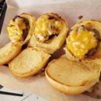 Sliders · 3 Hereford beef sliders served on Martin’s potato roll with American cheese, sauteed onions ...