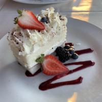 White Chocolate Mousse Cake · Raspberry coulis.