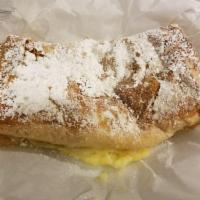 Bougatsa · Semi-sweet semolina custard baked in puff pastry phyllo and sprinkled with powdered sugar an...