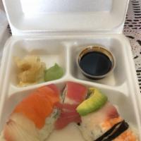 Rainbow Roll · Inside California roll, and outside tuna, salmon, tilapia, and shrimp ponzu sauce.