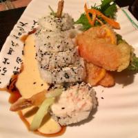 Shrimp Tempura Roll · Avocado, crab meat, cucumber with shrimp tempura and mayo, and eel sauce.