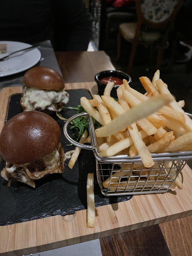 Filet Mignon Sliders · Mushrooms, caramelized onions, and gruyer cheese, served with french fries.