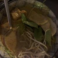 Curry Mee · Coconut curry noodle soup with egg ＆ glass noodles, tofu, chicken sausage, sour mustard gree...