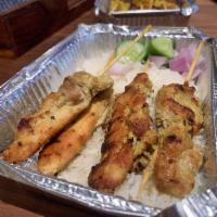 Chicken Sate · Chicken skewers, marinated in spices, aromatics, and coconut milk, grilled, and served with ...