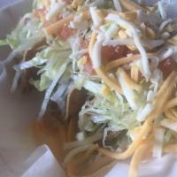 Crispy Tacos · Beyond meat crumble lettuce, tomato & nacho sauce.