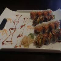 Golden Spider Roll · Soft shell crab tempura, cucumber and mayo topped with eel and avocado.