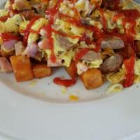 Country Inn Skillet · Sausage, bacon, ham, onion, scrambled eggs, Jack and cheddar, country potatoes, toast or pan...