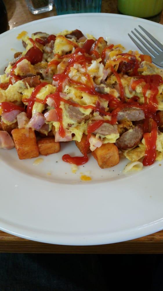 Country Inn Skillet · Sausage, bacon, ham, onion, scrambled eggs, Jack and cheddar, country potatoes, toast or pancakes. 