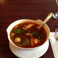 Tom Yum Noodle Soup · Noodle with chicken and fish balls in spicy hot and sour soup with scallions, bean sprouts a...
