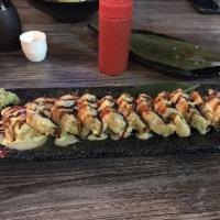 Las Vegas Roll · Inside deep fried, avocado, cream cheese, and crab meat. Outside salmon. Sauce honey mustard...
